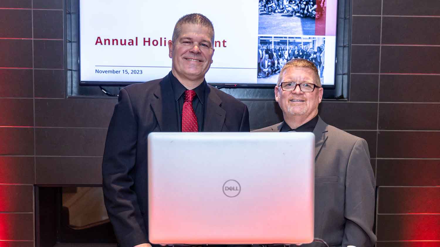 2 men with a laptop