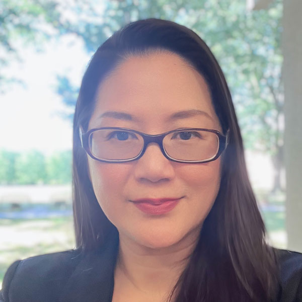 female with glasses and dark straight hair