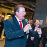 event attendee standing with microphone