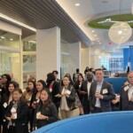 group of people standing and holding cups