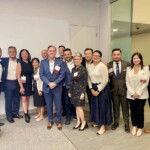 group of people standing and smiling