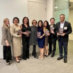 people standing in a group holding books