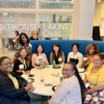 females sitting at a round table